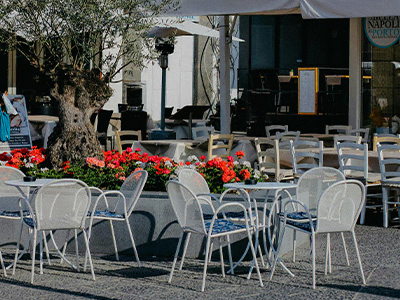 Commercial outdoor restaurant metal furniture setting - modern design, weatherproof for café terraces, hotels, and commercial dining areas